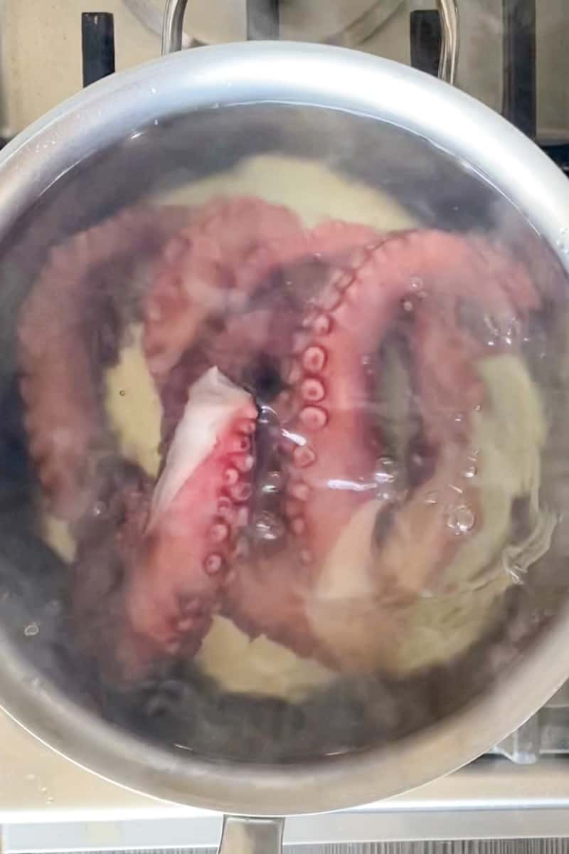 Turn the heat off and drop the cooked octopus into the water. We aren’t trying to cook the octopus, rather warm it up in the same water.