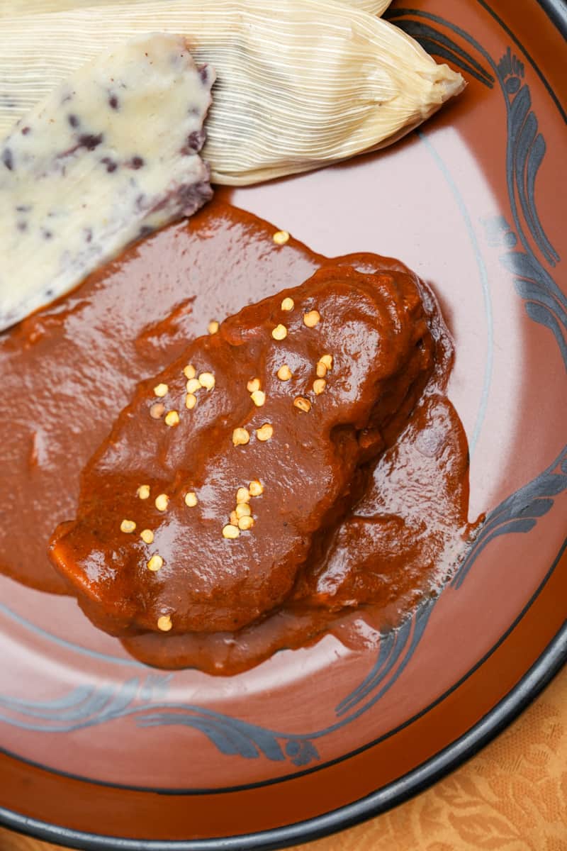 Add your choice of meat (previously cooked) into the sauce. Feel free to use some broth if the sauce becomes too thick. Enjoy this Mexican Mole Rojo Sauce Recipe. 