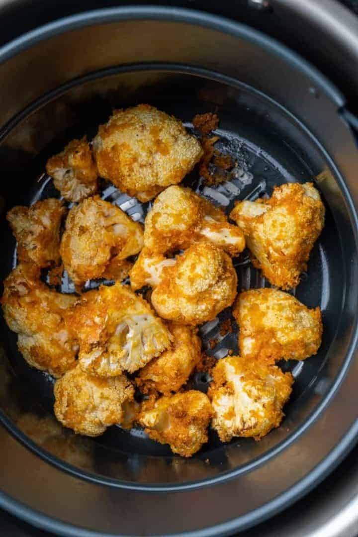 This Air Fryer Buffalo Cauliflower Recipe is made with cauliflower, hot sauce, spices, panko, parmesan cheese and air fried.