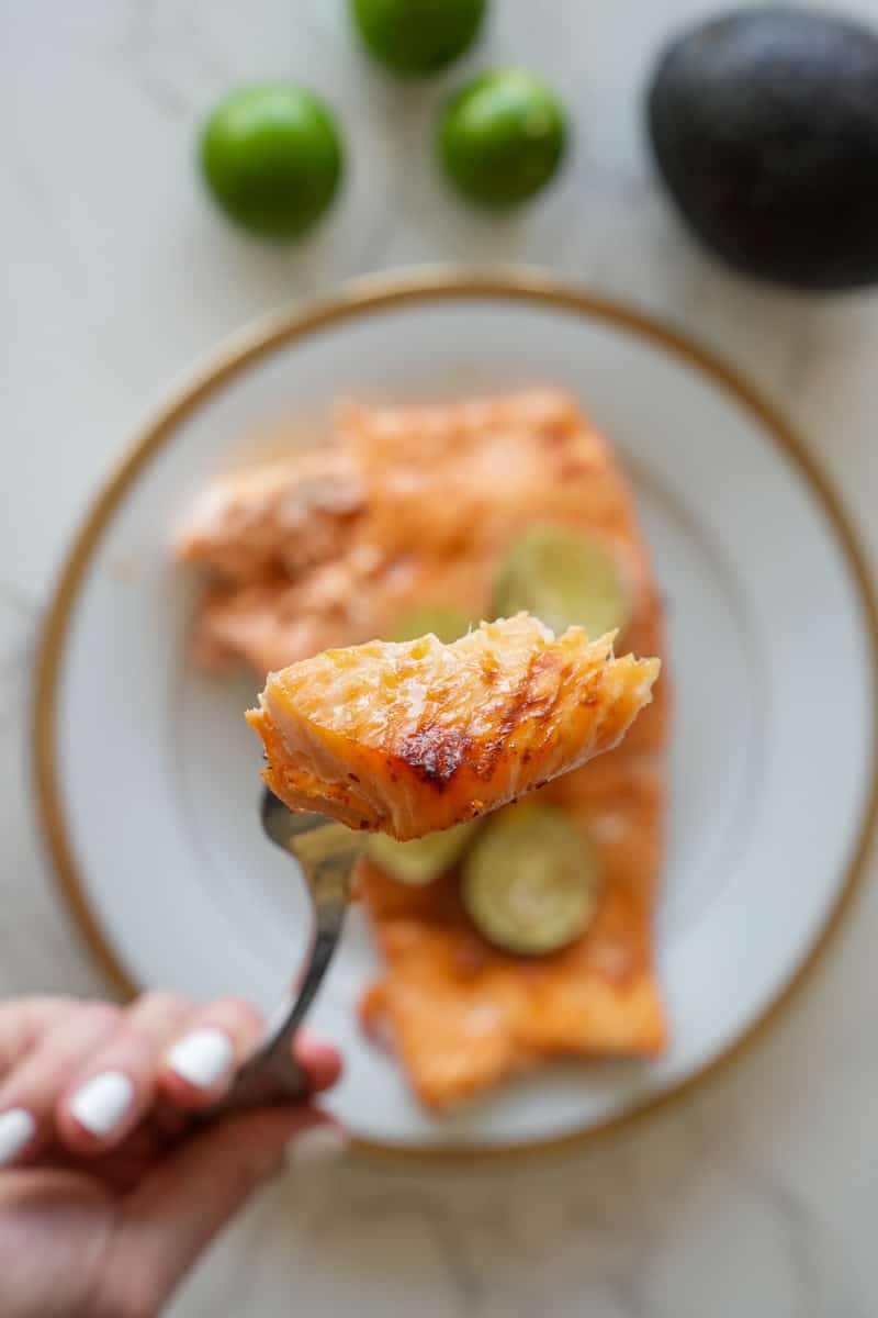 This Spicy Baked Salmon Recipe is made with fresh salmon, Tajin, honey, garlic powder and baked to perfection. 