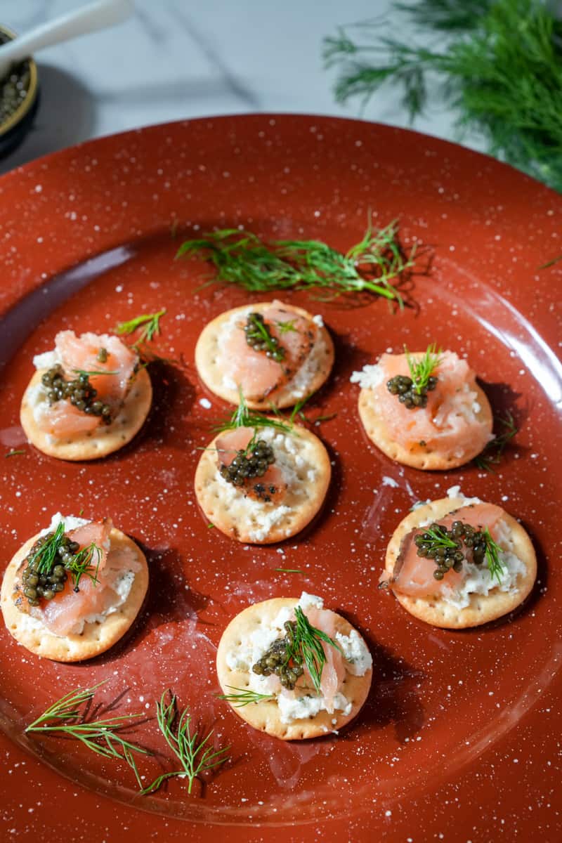 This Smoked Salmon Canapés Recipe with Caviar uses delicate smoked salmon, creamy cheese and caviar on a crisp cracker.