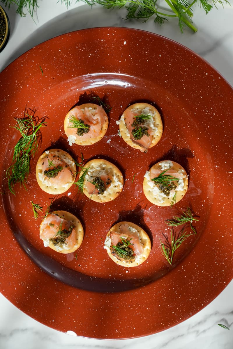 This Smoked Salmon Canapés Recipe with Caviar uses delicate smoked salmon, creamy cheese and caviar on a crisp cracker.