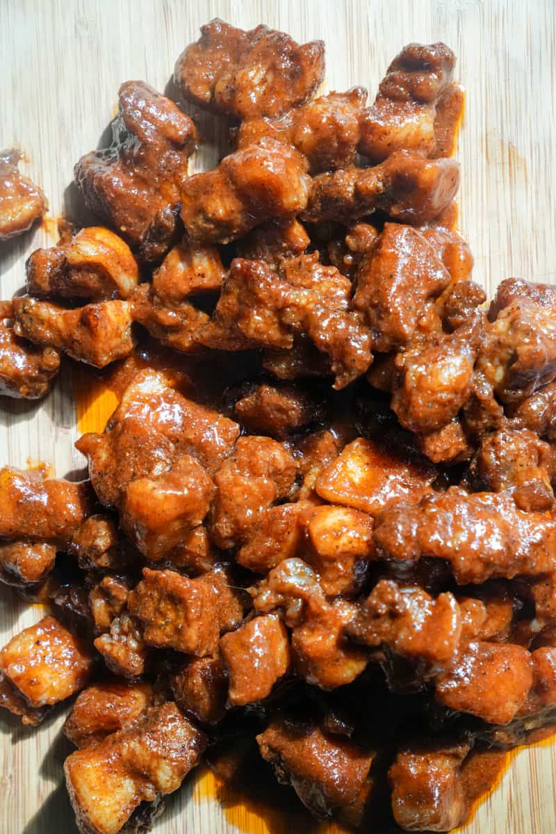 This Pork Belly Burnt Ends Recipe is tossed in barbecue rub and made in the smoker, and finally coated in barbecue sauce. 