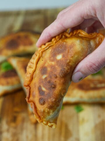 Savor the fusion of flavors with our Birria Empanadas: golden, flaky pastry envelopes filled with tender, savory birria meat, melding traditional Mexican spices with the comfort of handheld indulgence.