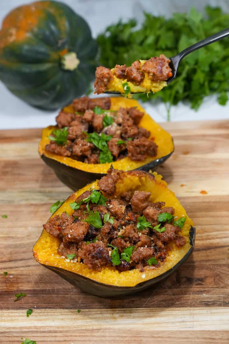 The Stuffed Acorn Squash Recipe is made with Italian sausage, aromatic sage, and the delightful surprise of dried cranberries.