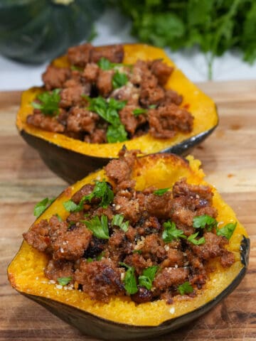 Indulge in a savory delight with our sausage stuffed acorn squash: plump, juicy sausages nestled within tender roasted acorn squash halves, perfectly complemented by a medley of aromatic herbs and spices.