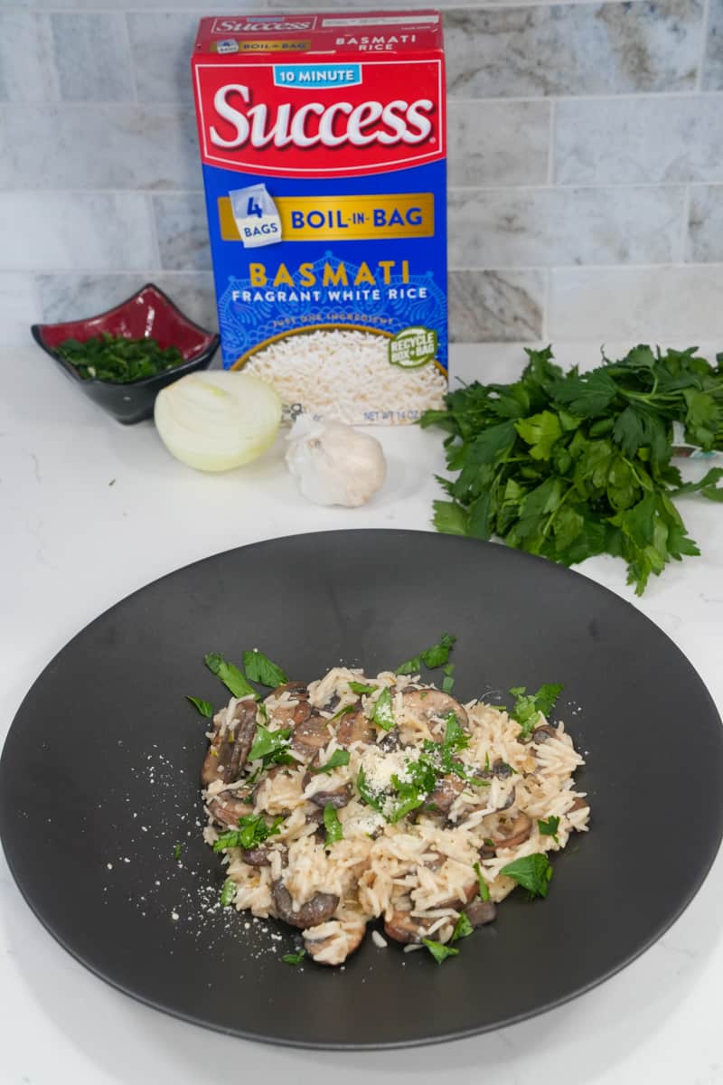 Remove the skillet from the heat and stir in the chopped parsley. Serve the mushroom risotto hot, garnished with grated Parmesan cheese if desired.