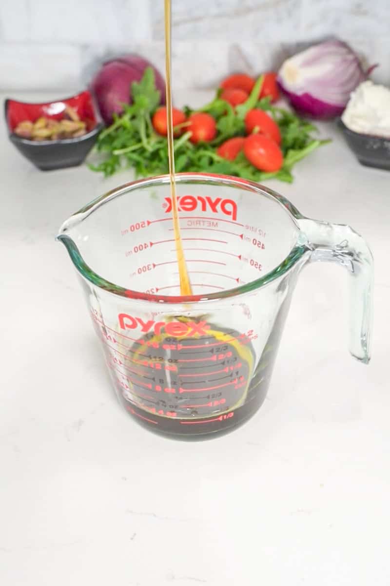 In a small bowl, whisk together balsamic vinegar, olive oil, honey (or maple syrup), salt, and pepper until well combined.